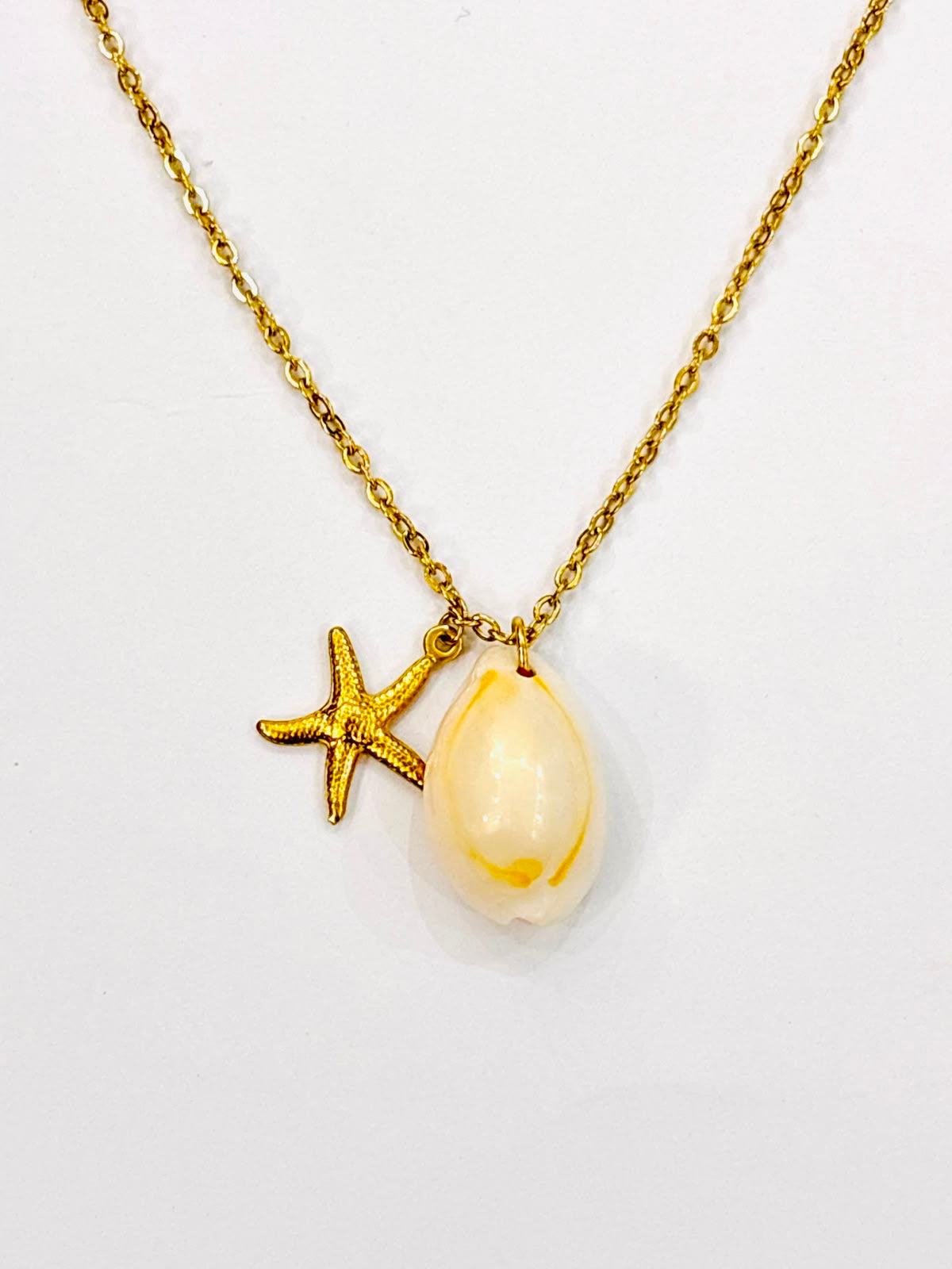 gold fish shell gold pendant