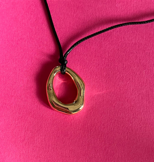 gold oval statement pendant
