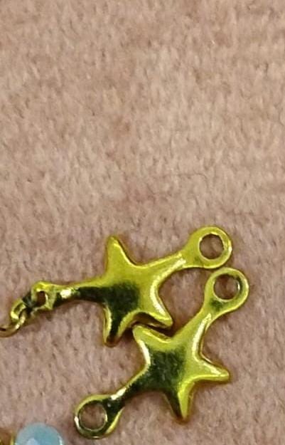 Golden star charm
